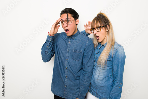 Young couple with glasses has just realized something and has intending the solution