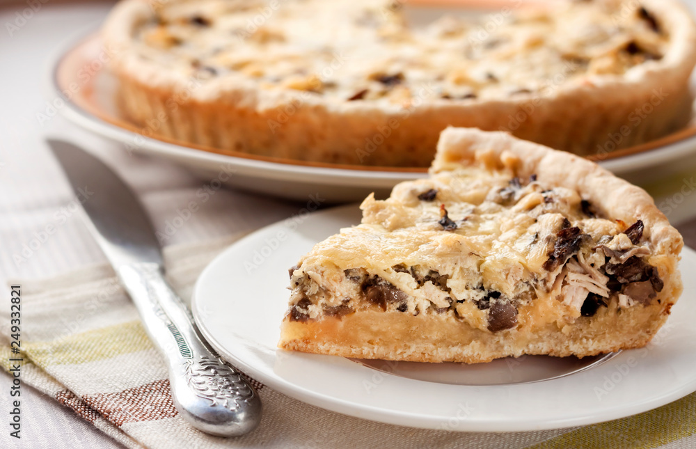 Slice of chicken tart with mushrooms and cheese Slice of chicken tart with mushrooms and cheese