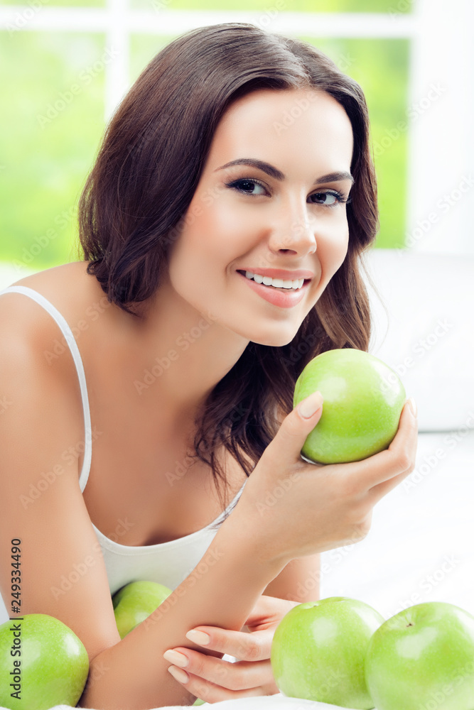 happy smiling woman with green apples, indoors happy smiling woman with green apples, indoors