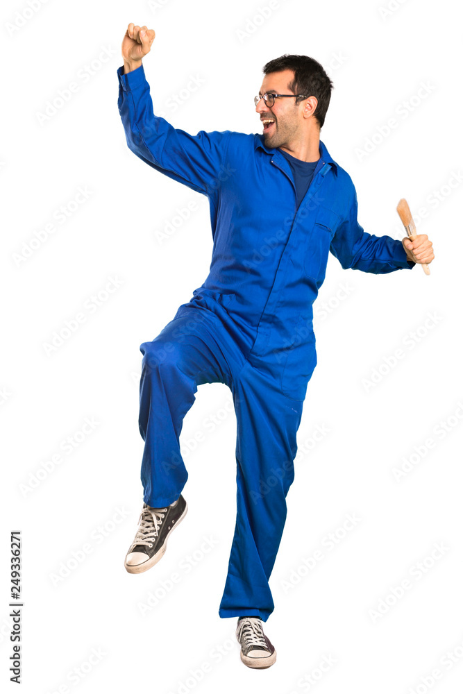 A full-length shot of a Painter man enjoy dancing while listening to music at a party on isolated white background A full-length shot of a Painter man enjoy dancing while listening to music at a party on isolated white background