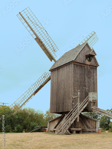 Old windmill made of wood in the field