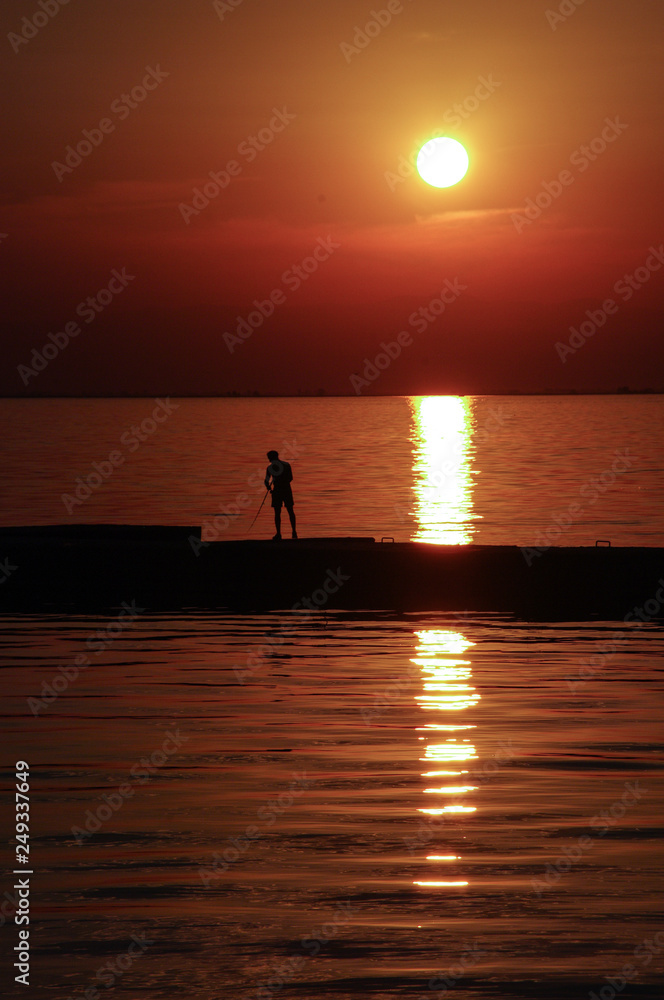 Fishing in sunset light, Thessaloniki, Greece