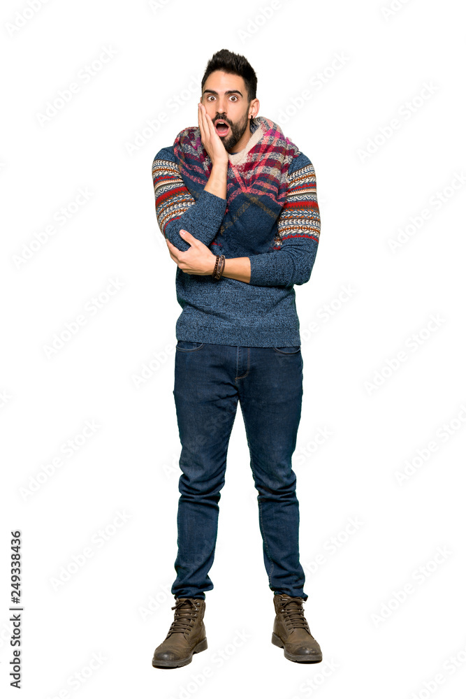 Full-length shot of Hippie man surprised and shocked while looking right on isolated white background Full-length shot of Hippie man surprised and shocked while looking right on isolated white background