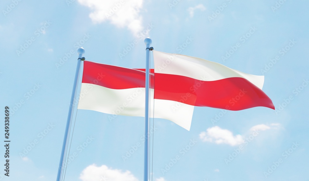 Poland and Indonesia, two flags waving against blue sky. 3d image Poland and Indonesia, two flags waving against blue sky. 3d image