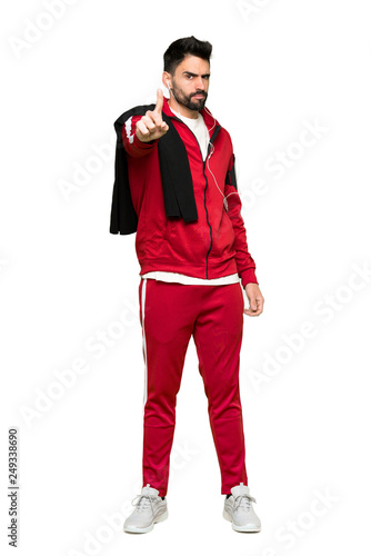 Full-length shot of Handsome sportman frustrated by a bad situation and pointing to the front on isolated white background