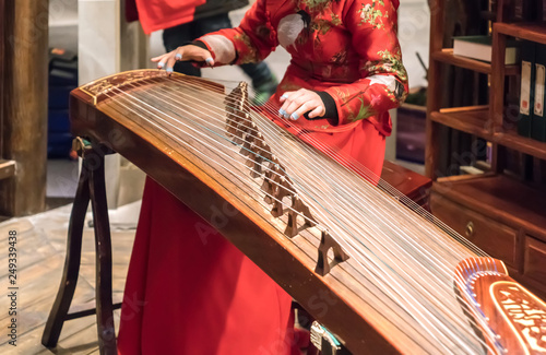 Women are playing zither, Chinese instruments