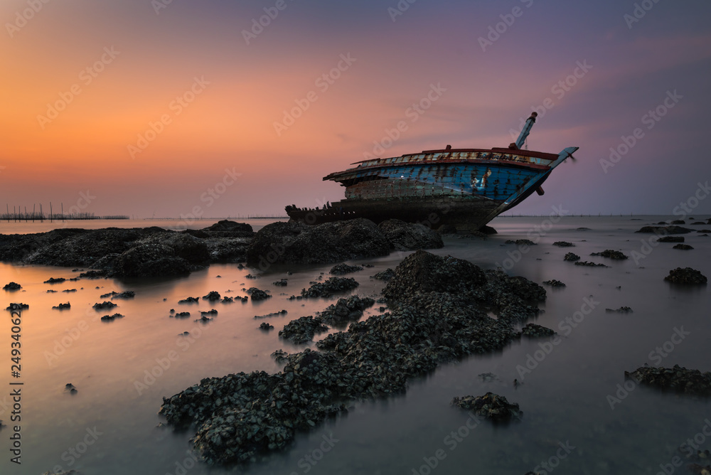 Shipwreck or wrecked boat on beach