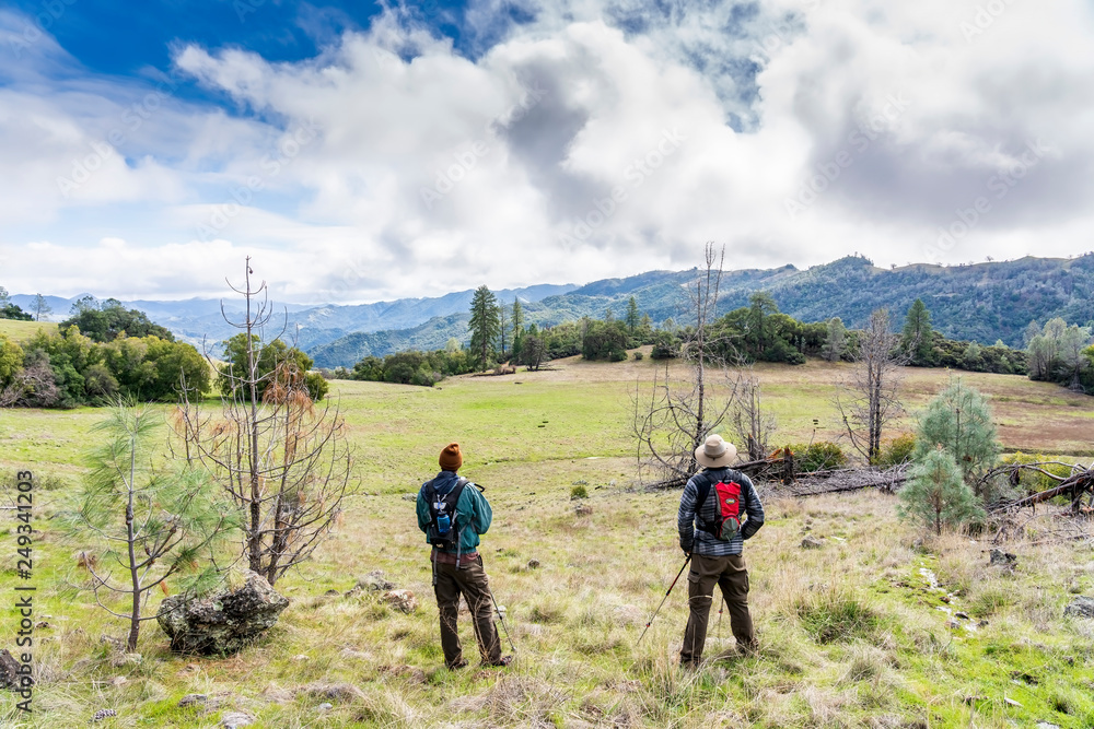Obraz premium Hikers in Coastal Mountains at a meadow