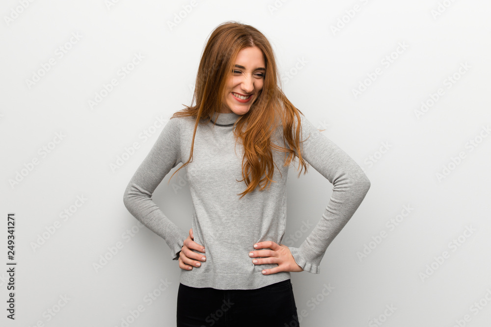 Redhead girl over white wall happy and smiling Redhead girl over white wall happy and smiling