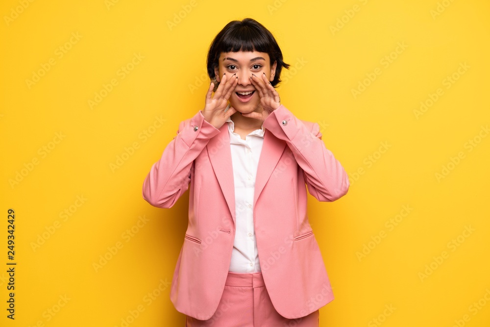 Modern woman with pink business suit shouting and announcing something Modern woman with pink business suit shouting and announcing something