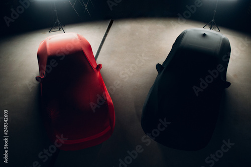 Фотография Luxury sports cars in the covers in the garage