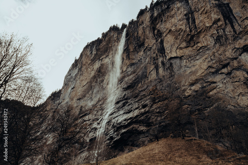 Waterfall in Lauterbrunnen, Switzerland. Winter landscape, cold.