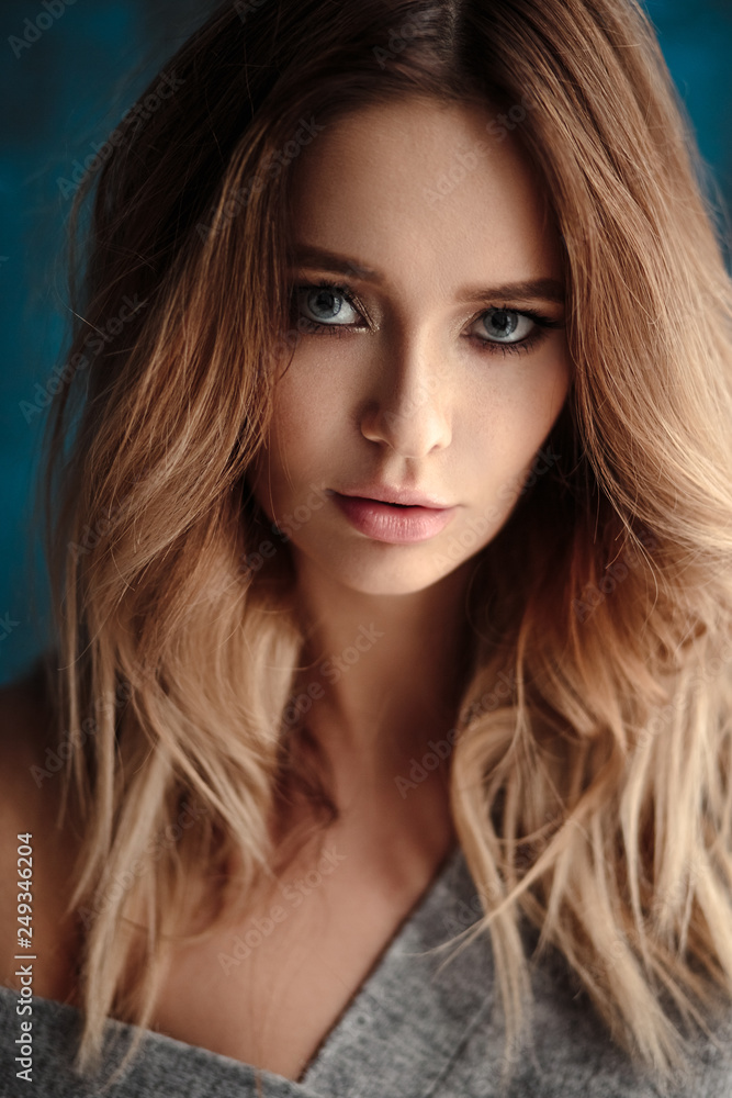 Fototapeta premium Portrait of sweet young blonde woman in artistic mood, fashion and beauty, casual style