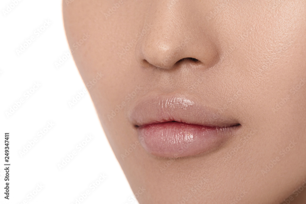 Female lips after augmentation procedure close-up. clean skin. Female lips after augmentation procedure close-up. clean skin.