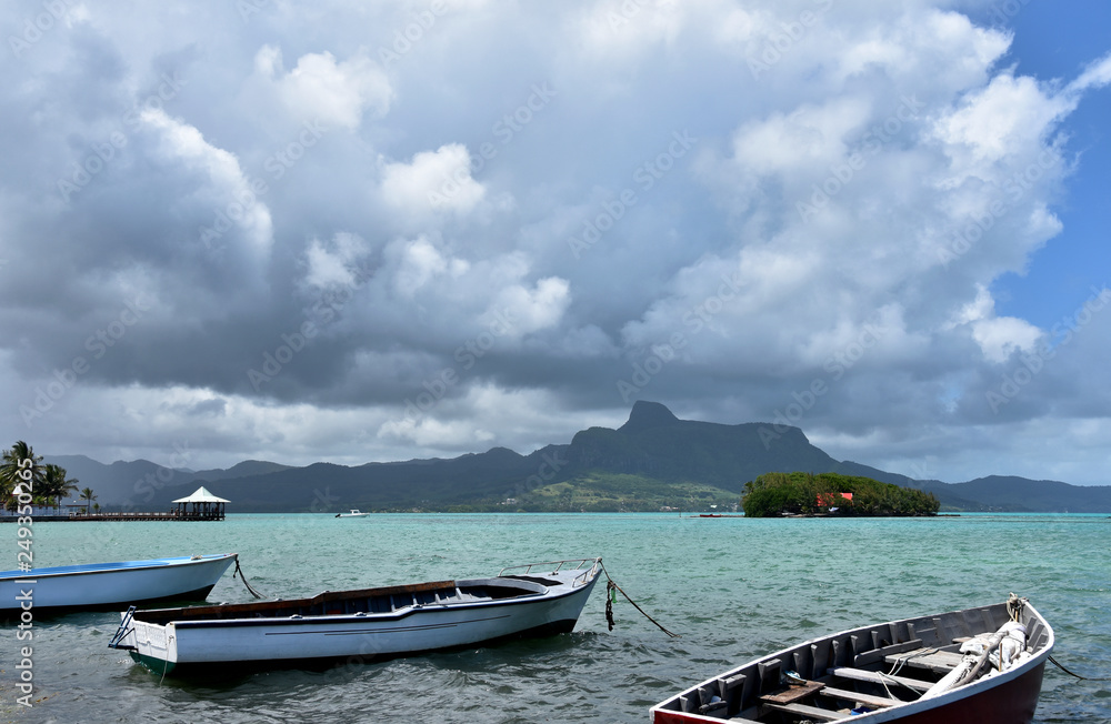 Tropical Island Boat stock images. Mahebourg Mauritius stock images. Mauritius landscape with sea. Coast with clouds. Summer landscape photography. Indian Ocean images Tropical Island Boat stock images. Mahebourg Mauritius stock images. Mauritius landscape with sea. Coast with clouds. Summer landscape photography. Indian Ocean images