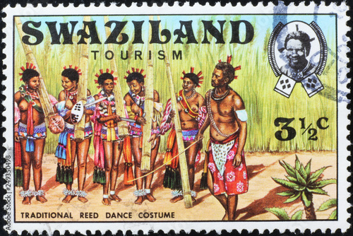 Costumes for traditional dance in Swaziland on stamp photo
