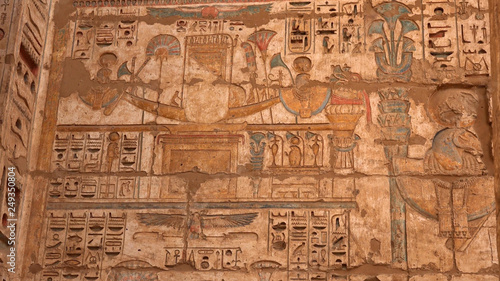 photography Ancient Egyptian carvings of people and hieroglyphics on the exterior walls of an ancient temple