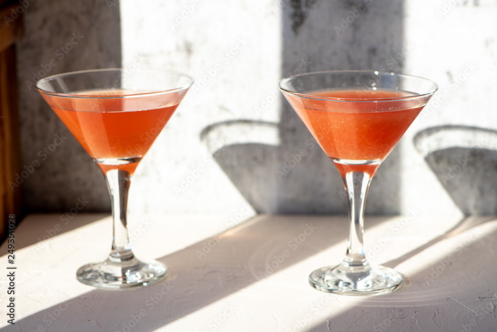 Orange cocktail on gray background Orange cocktail on gray background