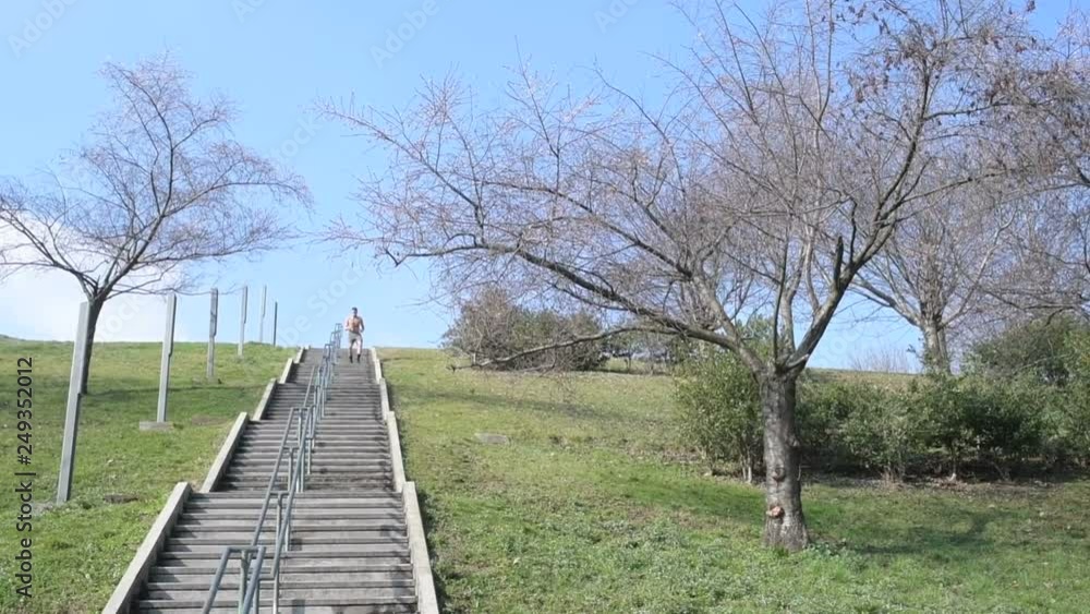 young man running downstairs outdoor in the city - exercise, challenging, sport concept