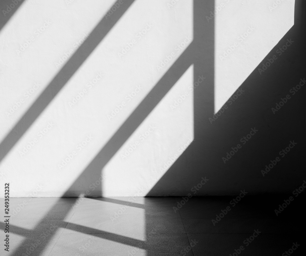 Abstract background of a white wall with shadows from the window. - monochrome Abstract background of a white wall with shadows from the window. - monochrome