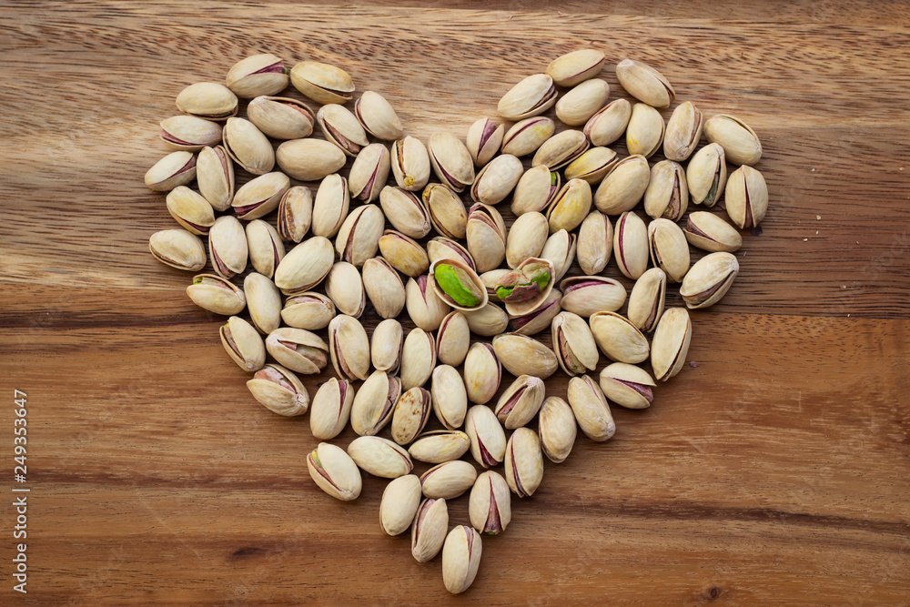 Dried pistachios in small sack. Grain for healthy. Good fat. Dried pistachios in small sack. Grain for healthy. Good fat.