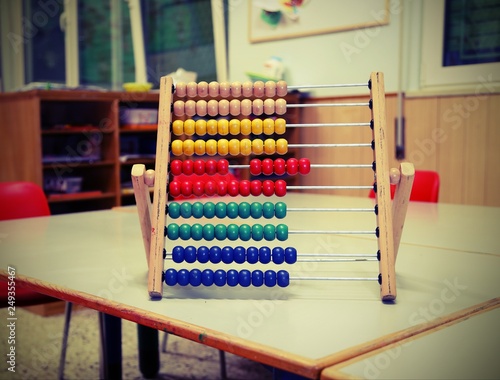 wooden abacus in the classroom to learn decimal numeral system w photo