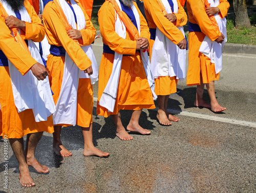 many people of sikh religion without shoes on the street