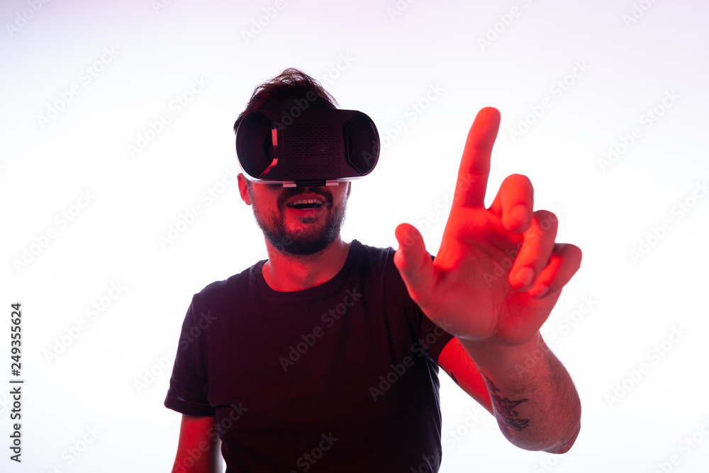 Cheerful man touching screen in virtual reality Cheerful man touching screen in virtual reality