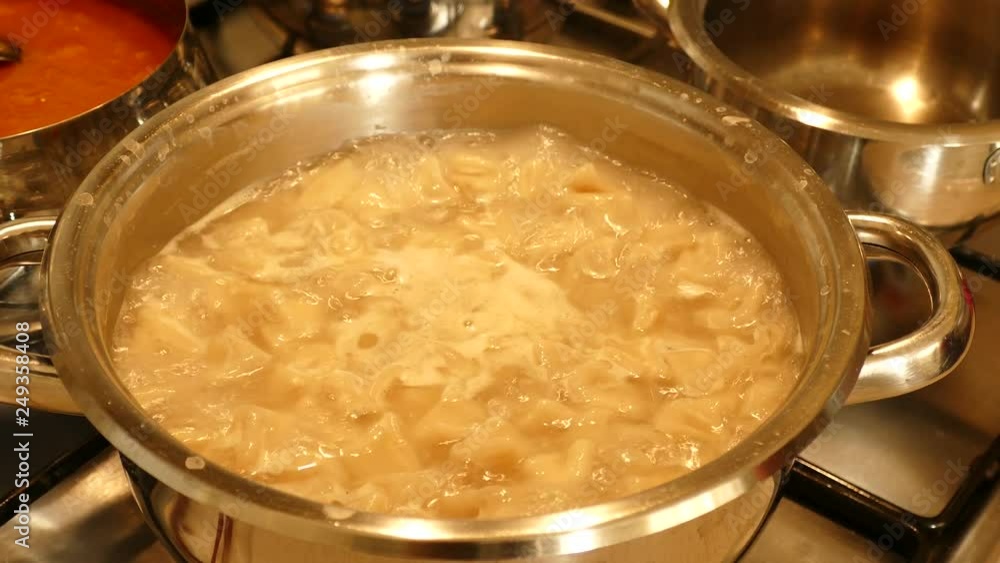 cooking dishes in cookware on the cooker, dinner is cooked on the stove, cooking dishes in cookware on the cooker, dinner is cooked on the stove,