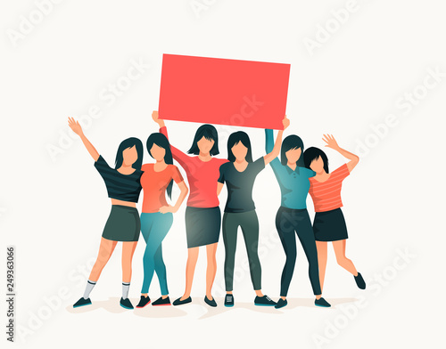 A Group Of Women Standing Together Holding Up A Sign