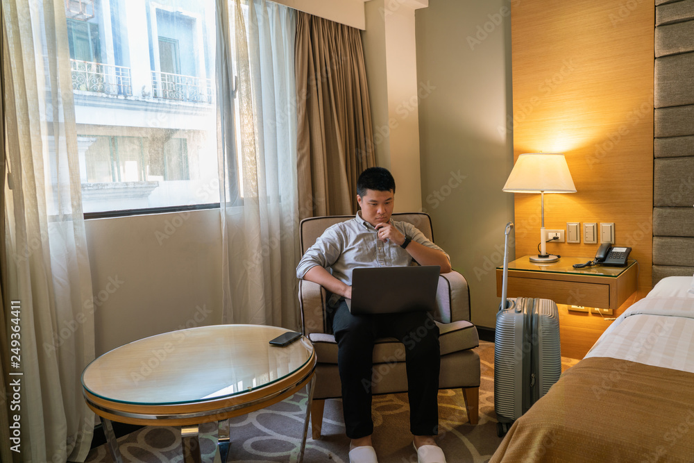 Young businessman working on laptop in the business trip Young businessman working on laptop in the business trip
