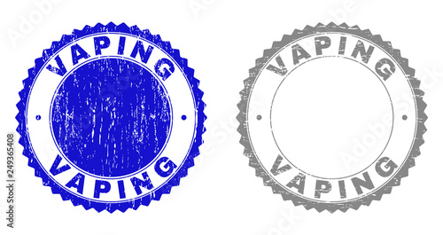 Grunge VAPING stamps isolated on a white background. Rosette seals with grunge texture in blue and gray colors. Vector rubber stamp imitation of VAPING tag inside round rosette.