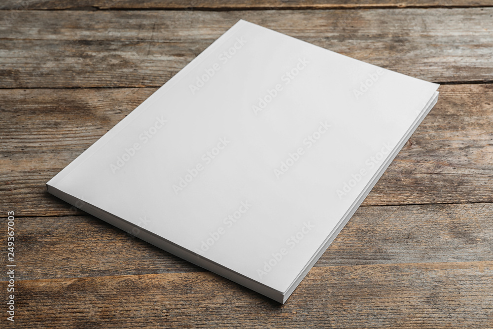 Brochure with blank cover on wooden background. Mock up for design Brochure with blank cover on wooden background. Mock up for design
