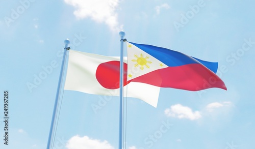 Photography Philippines and Japan, two flags waving against blue sky