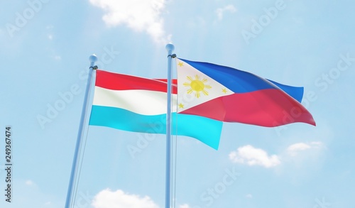 Philippines and Luxembourg, two flags waving against blue sky. 3d image
