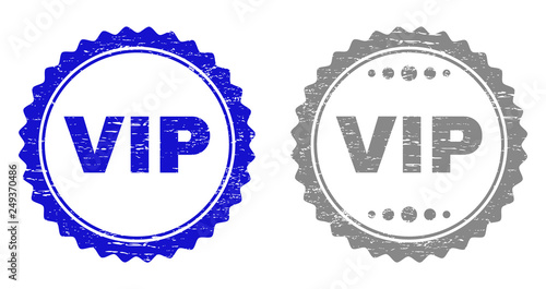 Grunge VIP stamp seals isolated on a white background. Rosette seals with distress texture in blue and gray colors. Vector rubber stamp imitation of VIP title inside round rosette.
