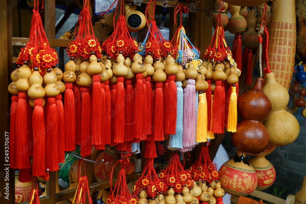 Rows of red and blue traditional Chinese souvenirs