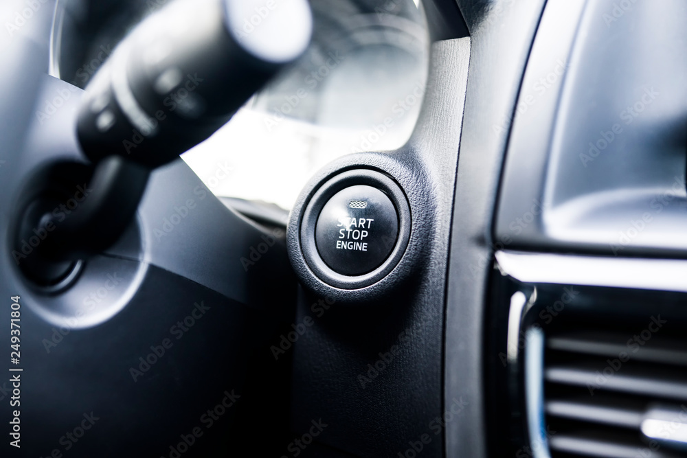 Naklejka premium Car interior. Start button. Black and white image.