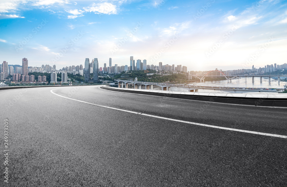 The expressway and the modern city skyline are in Chongqing, China. The expressway and the modern city skyline are in Chongqing, China.