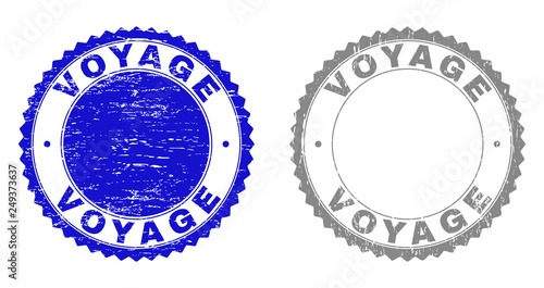Grunge VOYAGE stamp seals isolated on a white background. Rosette seals with grunge texture in blue and gray colors. Vector rubber stamp imitation of VOYAGE label inside round rosette.