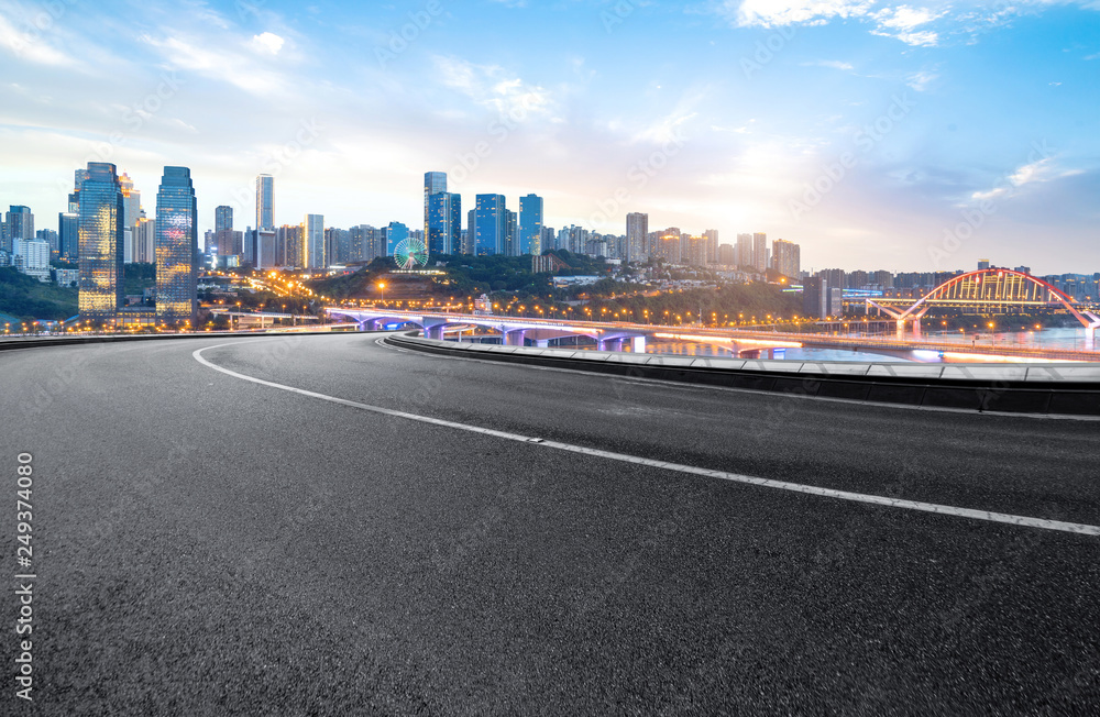 The expressway and the modern city skyline are in Chongqing, China.