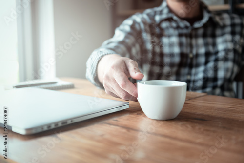 Hipster young man drinking coffee in the cafe., How to lifestyle of young Asian businessman in the weekend activity relaxing with the coffee. drinking concept.