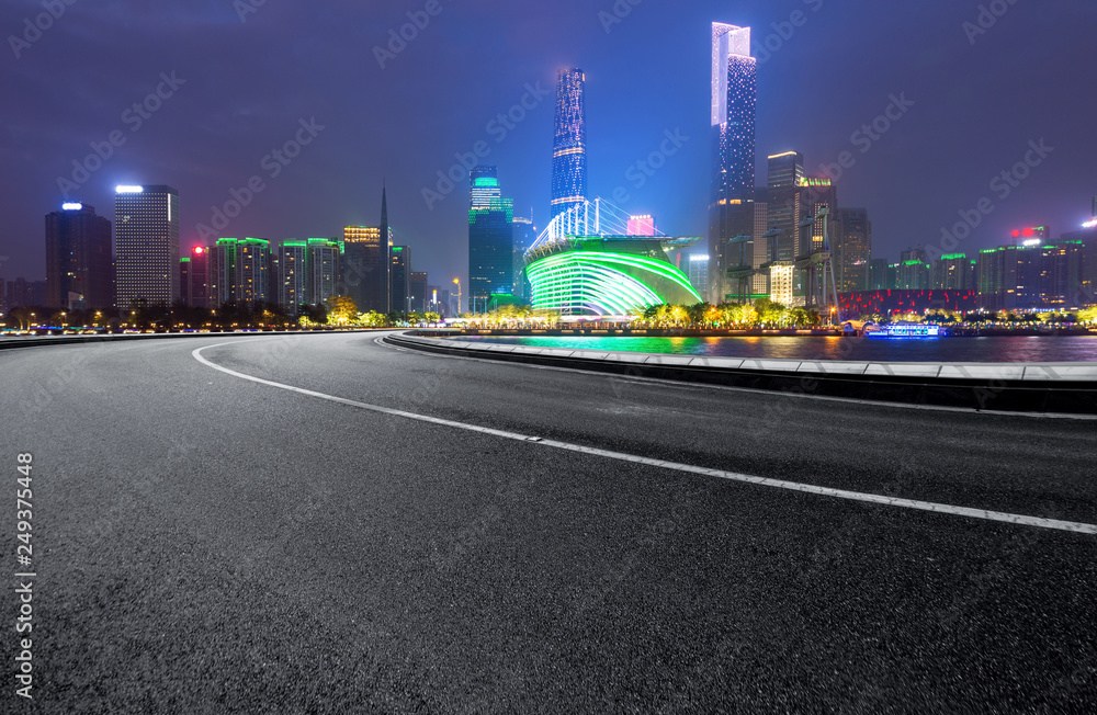The expressway and the modern city skyline are in guangzhou, China.