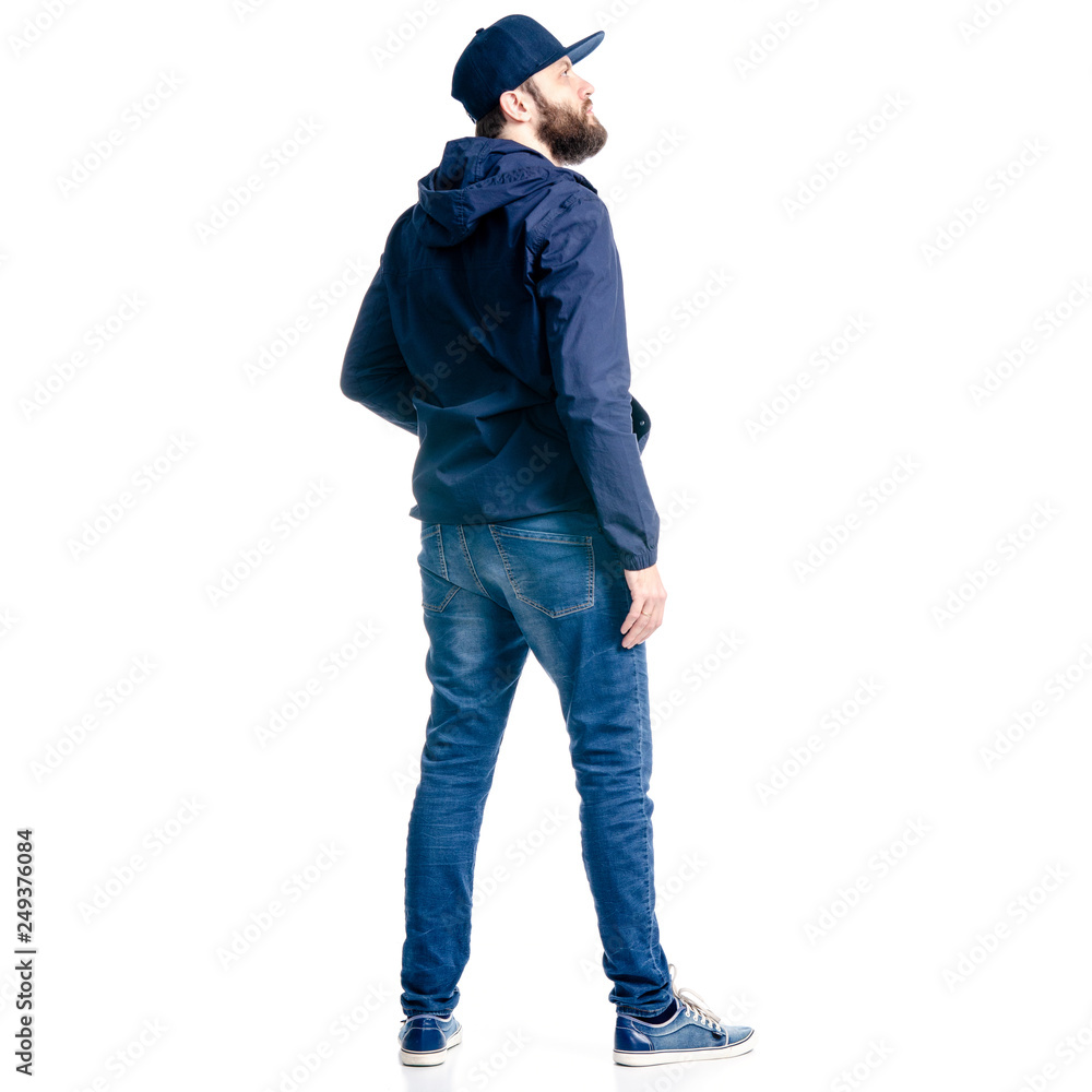 A man in jeans and jacket standing looking on white background isolation, back view A man in jeans and jacket standing looking on white background isolation, back view