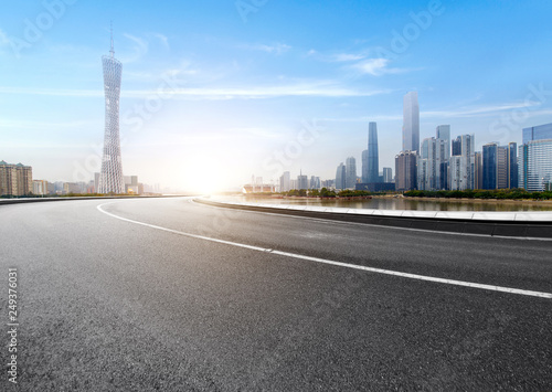 The expressway and the modern city skyline are in guangzhou, China.