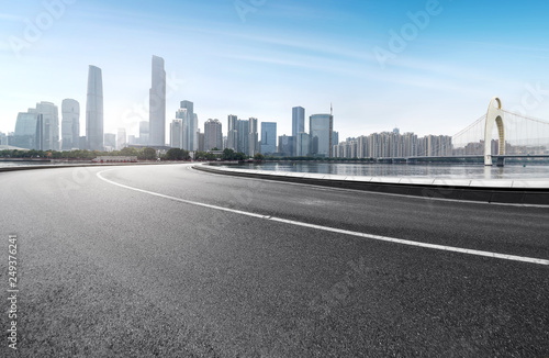 The expressway and the modern city skyline are in guangzhou, China.