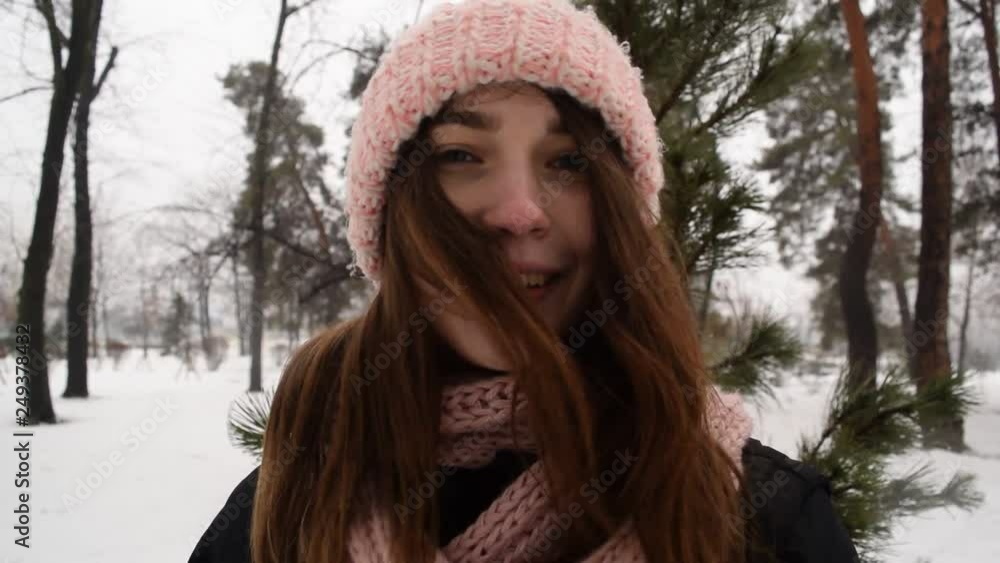 Cute portrait of brunette girl in hat. Winter park. Cute portrait of brunette girl in hat. Winter park.