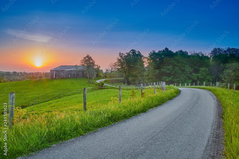 Sunrise Along  a Counrty Road with Barn