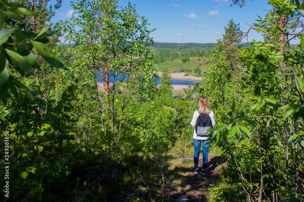 young woman hiking in the forest young woman hiking in the forest