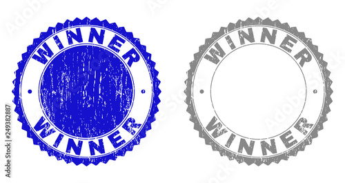 Grunge WINNER stamp seals isolated on a white background. Rosette seals with grunge texture in blue and grey colors. Vector rubber stamp imprint of WINNER caption inside round rosette.